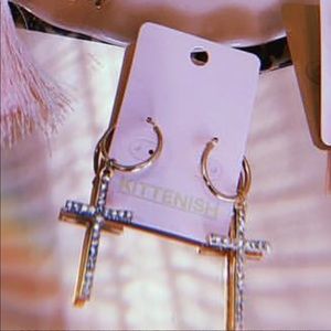 ISO kittenish cross earrings